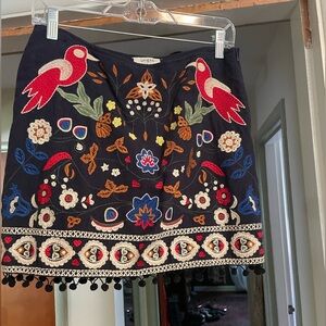 Adorable embroidered skirt with pom-pom trim. (M)